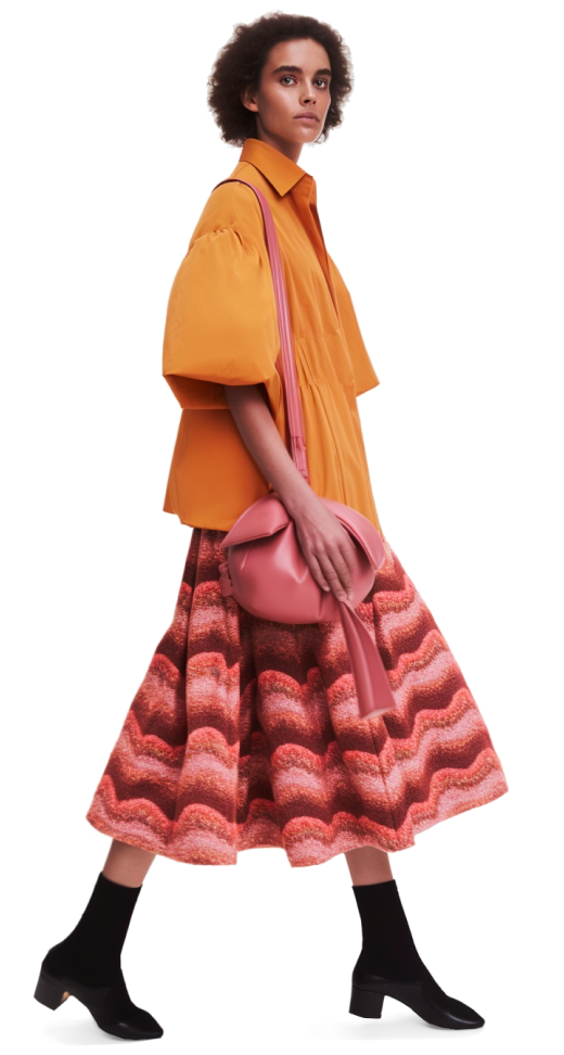 Lady in modern orange blouse and wavy skirt
